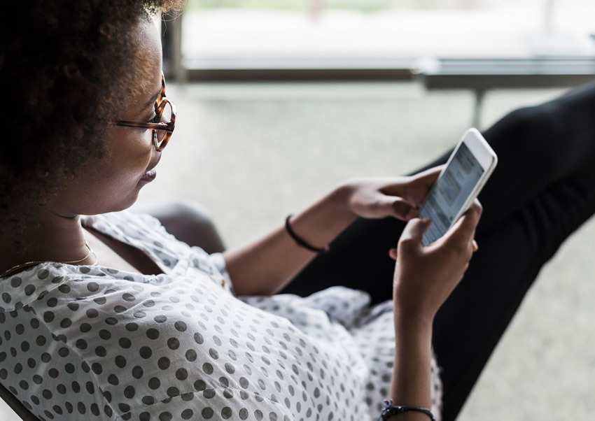 An Ethiopian woman using her mobile phone